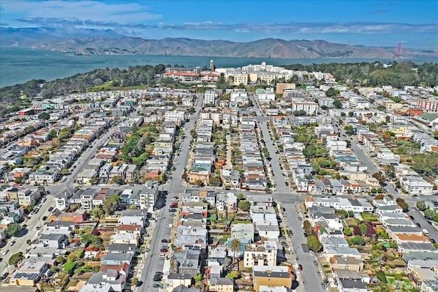 birds eye view of property with a mountain view