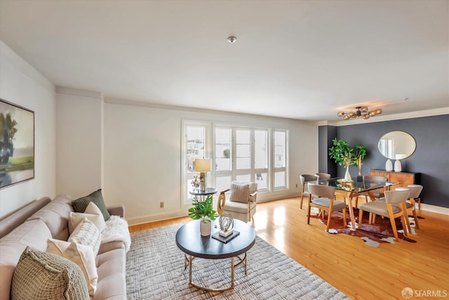 living area featuring light wood-type flooring and baseboards