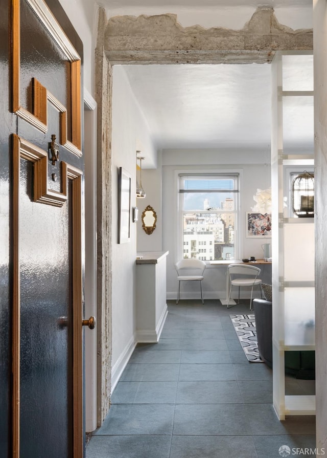 hall with tile patterned flooring