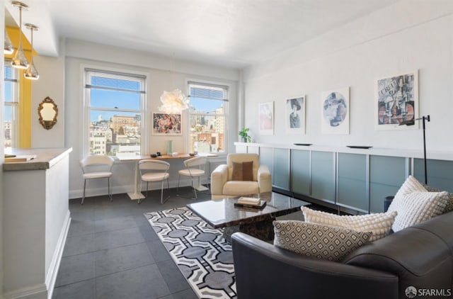 living area with dark tile patterned floors