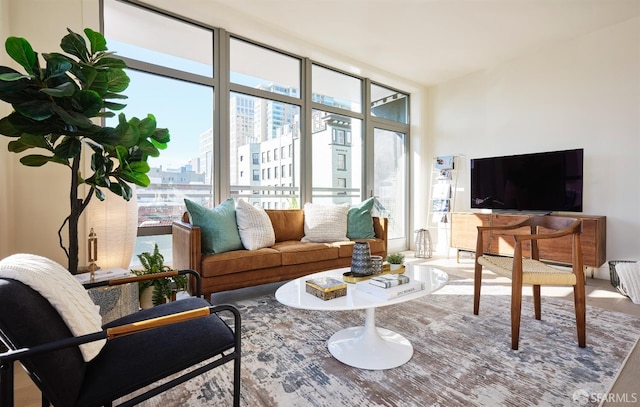 living room featuring plenty of natural light and floor to ceiling windows