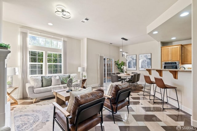 living room with an inviting chandelier