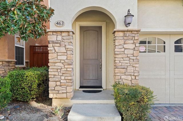 doorway to property featuring a garage