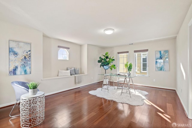 living area with dark hardwood / wood-style floors