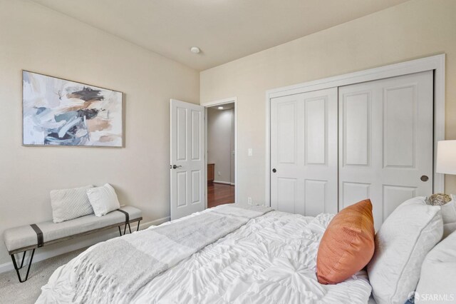 carpeted bedroom featuring a closet