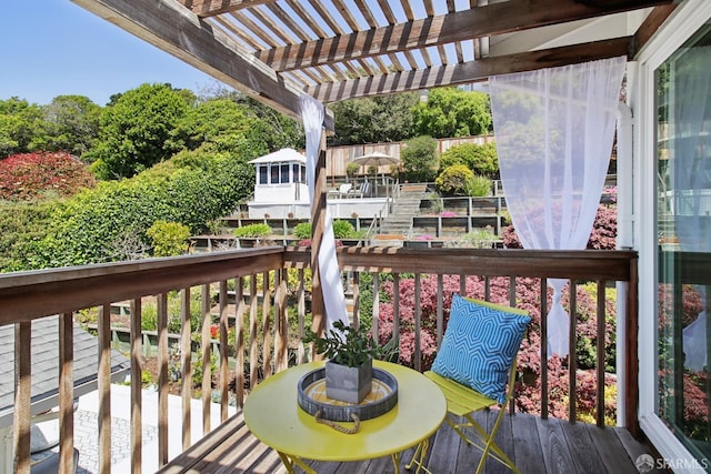 wooden deck featuring a pergola