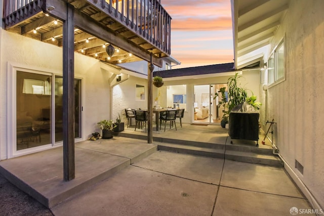 view of patio featuring outdoor dining space and a balcony