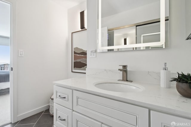 bathroom featuring ensuite bath, tile patterned flooring, and vanity