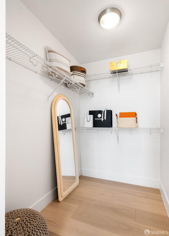 spacious closet with light wood-style floors