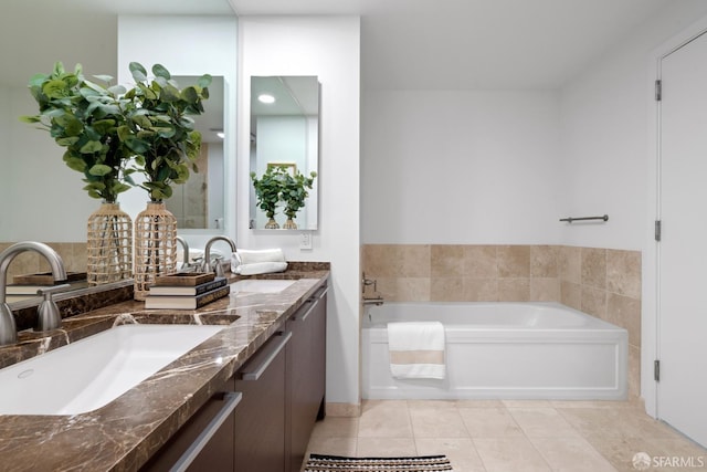 full bathroom featuring tile patterned flooring, a sink, a garden tub, and double vanity