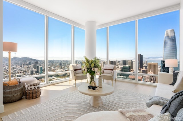 sunroom / solarium featuring a city view