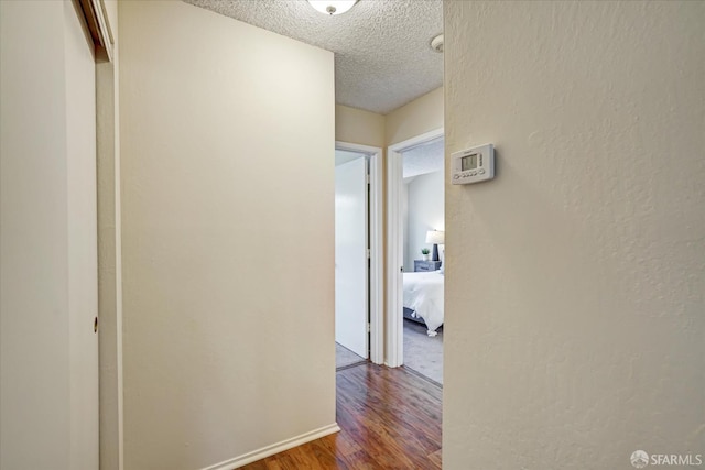 503 Camelback Rd, Pleasant Hill, CA 94523 - corridor featuring a textured ceiling, wood finished floors, and a textured wall