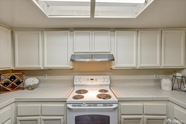 503 Camelback Rd, Pleasant Hill, CA 94523 - kitchen featuring under cabinet range hood, electric range, and white cabinets