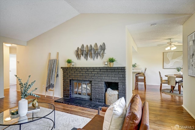 503 Camelback Rd, Pleasant Hill, CA 94523 - living room with vaulted ceiling, a fireplace, wood finished floors, a ceiling fan, and a textured ceiling