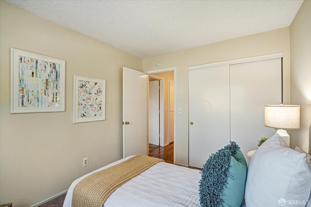 503 Camelback Rd, Pleasant Hill, CA 94523 - bedroom with a closet, a textured ceiling, and carpet flooring