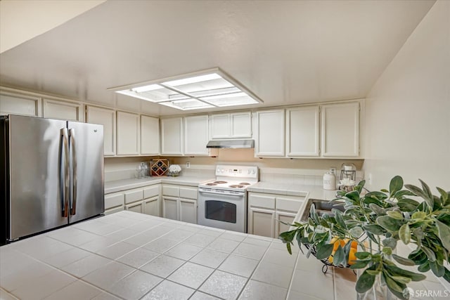 503 Camelback Rd, Pleasant Hill, CA 94523 - kitchen with freestanding refrigerator, white electric range oven, tile countertops, under cabinet range hood, and a skylight