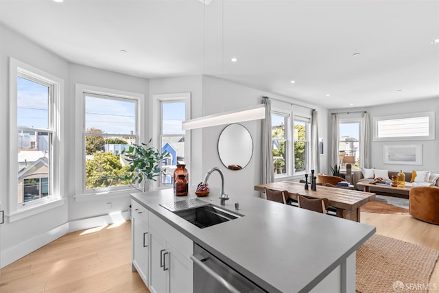 38 Steiner St Unit 303, San Francisco, CA 94114 - kitchen featuring dishwasher, plenty of natural light, light wood-style flooring, open floor plan, and recessed lighting