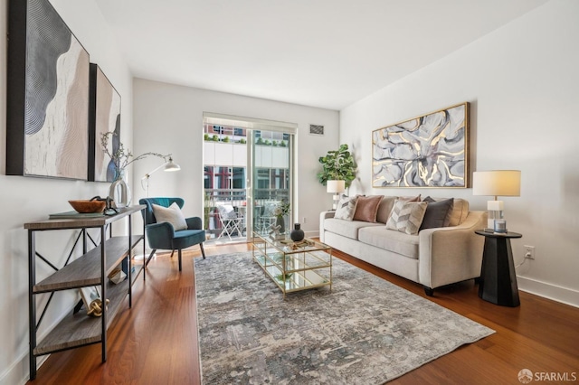 living room with dark hardwood / wood-style floors