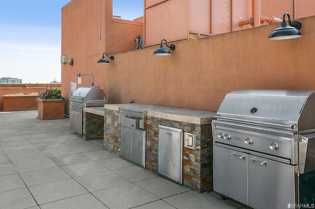 view of patio with grilling area and exterior kitchen