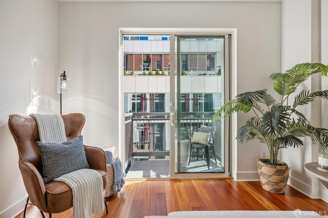 sitting room with hardwood / wood-style floors