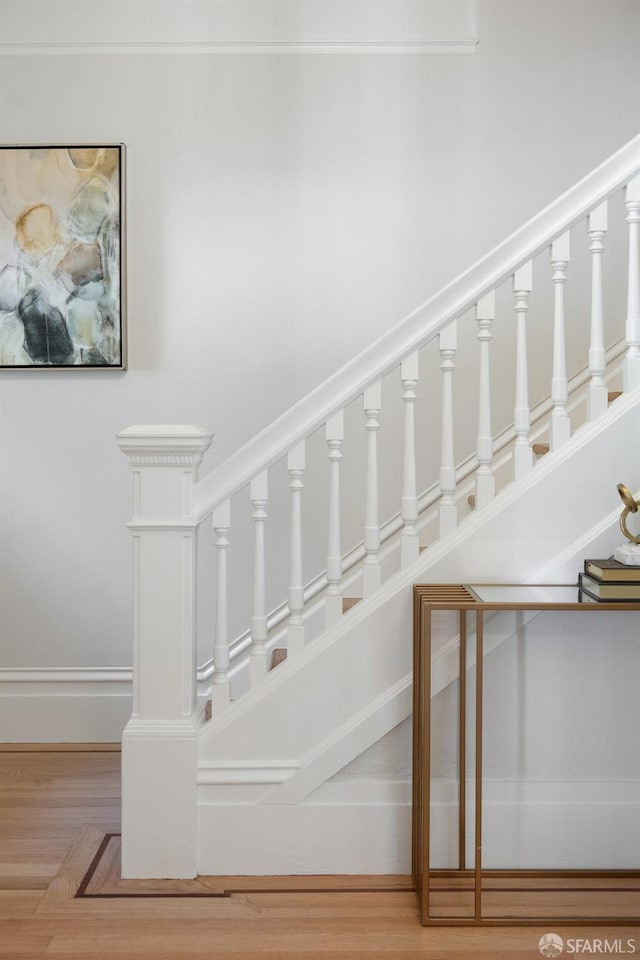 stairs with wood finished floors