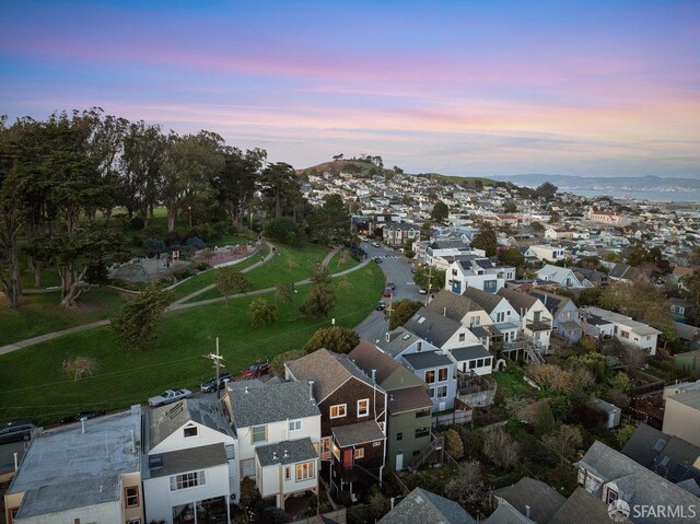 birds eye view of property with a residential view