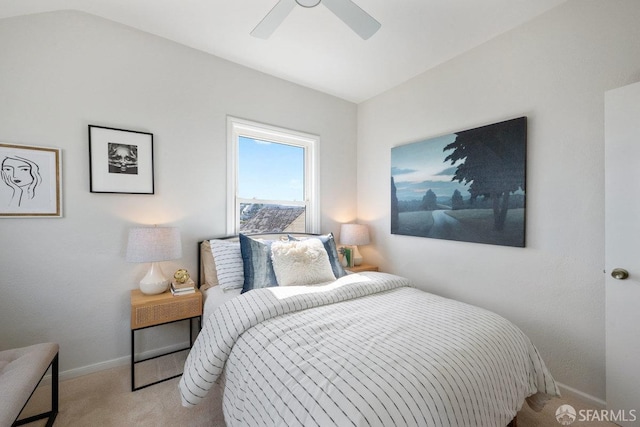 carpeted bedroom with ceiling fan and baseboards