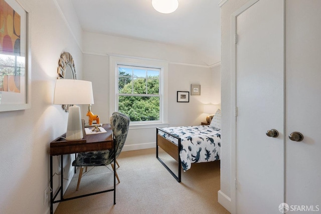 carpeted bedroom with baseboards