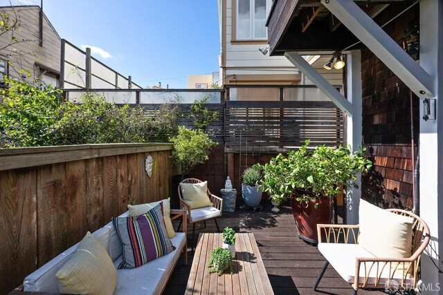 wooden deck featuring an outdoor living space