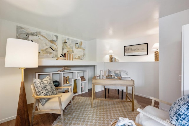 living area featuring wood finished floors and baseboards