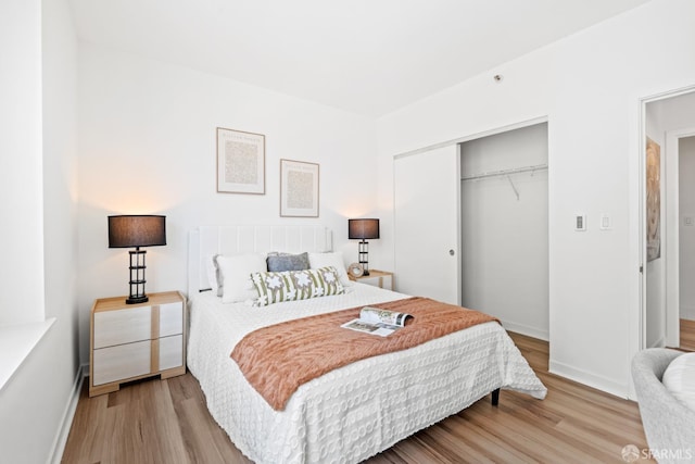 250 King St Unit 536, San Francisco, CA 94107 - bedroom featuring a closet and wood finished floors