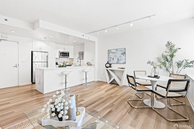 250 King St Unit 536, San Francisco, CA 94107 - living room with light wood-type flooring, track lighting, and recessed lighting