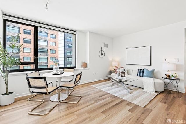 250 King St Unit 536, San Francisco, CA 94107 - living area featuring light wood-type flooring and track lighting