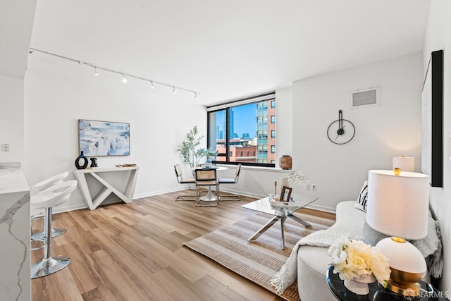 250 King St Unit 536, San Francisco, CA 94107 - living room with rail lighting and wood finished floors