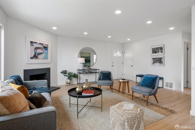 281 Polaris Way, Daly City, CA 94014 - living area with light wood-style floors, recessed lighting, and a fireplace with raised hearth