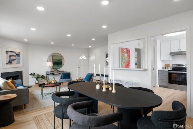 281 Polaris Way, Daly City, CA 94014 - dining room featuring light wood-style floors, recessed lighting, and a fireplace with raised hearth
