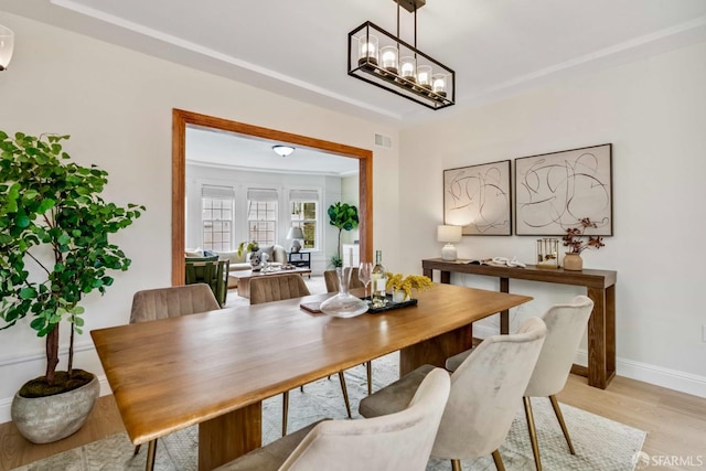 1210 40th Ave, San Francisco, CA 94122 - dining room featuring light wood-style floors and a chandelier