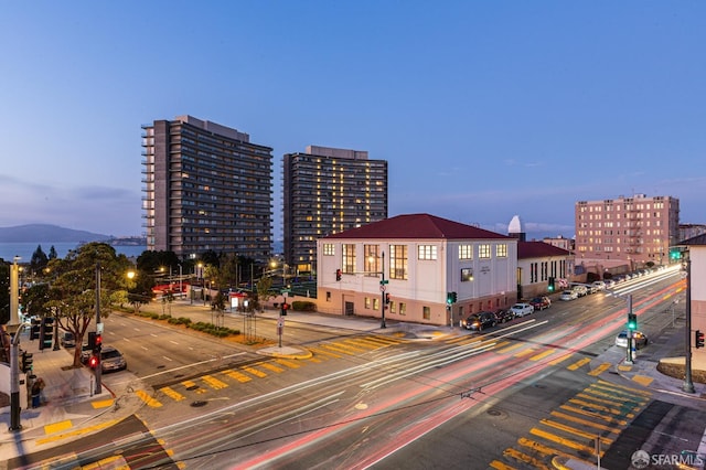 property at dusk with a view of city