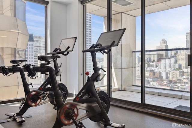 611 Washington St Unit 2505, San Francisco, CA 94111 - gym with a city view and floor to ceiling windows