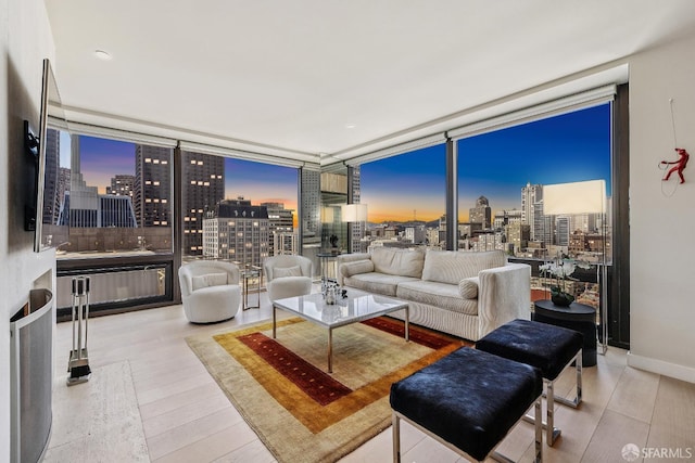 611 Washington St Unit 2505, San Francisco, CA 94111 - living area with a skyline view, a wall of windows, and wood finished floors
