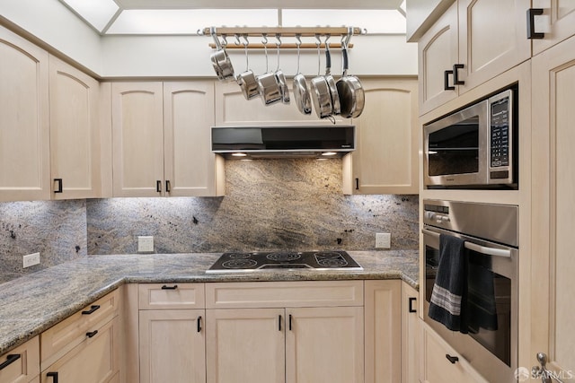611 Washington St Unit 2505, San Francisco, CA 94111 - kitchen featuring stainless steel appliances, decorative backsplash, ventilation hood, light brown cabinetry, and light stone countertops