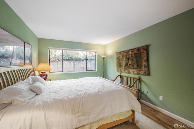 bedroom featuring hardwood / wood-style floors