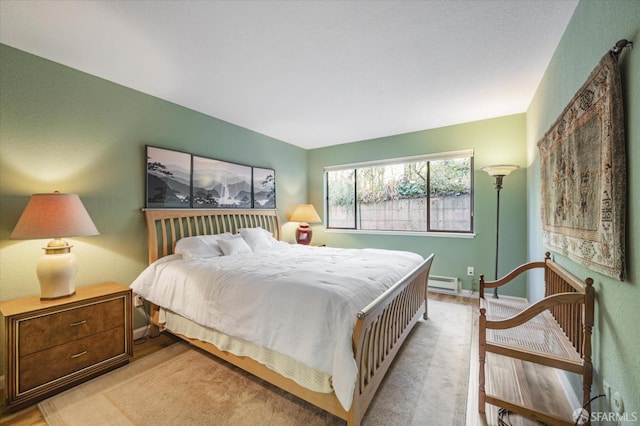 bedroom featuring a baseboard radiator