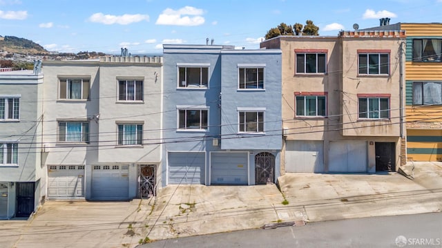 19 Castillo St, San Francisco, CA 94134 - view of building exterior with a garage and driveway