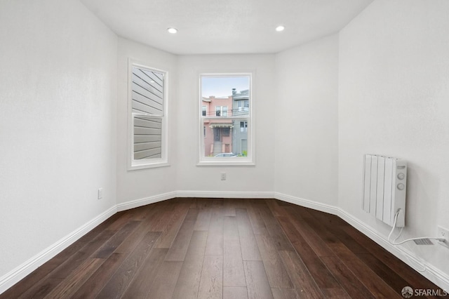 63-65 Jersey St, San Francisco, CA 94114 - spare room with radiator, dark wood-type flooring, and recessed lighting