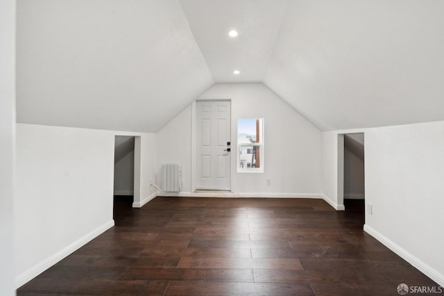 63-65 Jersey St, San Francisco, CA 94114 - bonus room with radiator heating unit, vaulted ceiling, wood finished floors, and recessed lighting