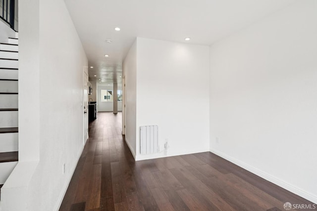 63-65 Jersey St, San Francisco, CA 94114 - corridor featuring radiator, dark wood-style flooring, recessed lighting, and stairway