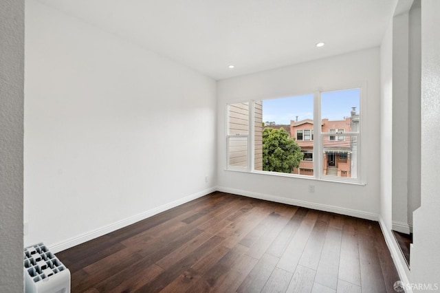 63-65 Jersey St, San Francisco, CA 94114 - unfurnished room featuring radiator heating unit, dark wood-style flooring, and recessed lighting