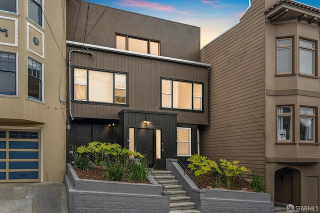 63-65 Jersey St, San Francisco, CA 94114 - townhome / multi-family property with a garage and stucco siding