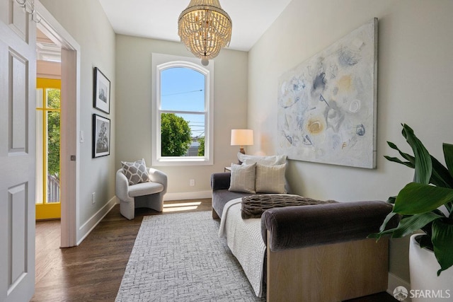 3790 Cesar Chavez St, San Francisco, CA 94110 - living area featuring a chandelier, dark wood-style floors, and baseboards